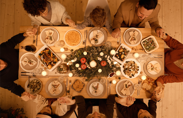 Holiday gathering with food on the table.