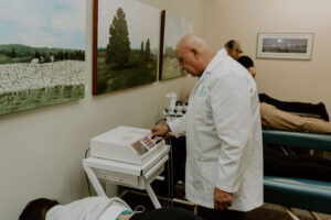 Dr. Tony setting patient up on PEMF therapy