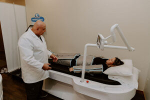 Dr. Tony talking to patient during Pressotherapy session.