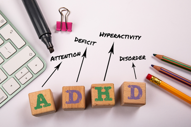 Blocks spelling out ADHD with the meaning of the acronym